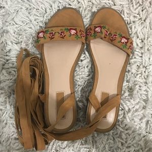 Tan tie up heels with floral detailing